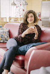 Young smiling woman using mobile phone - FOLF08322
