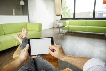 Businessman using tablet at home - PESF01017