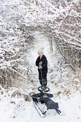 Boy dragging sledge - FOLF08755