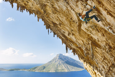 Rock climber on steep cliff at Kalymnos, Greece - FOLF08855