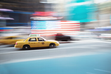 Yellow taxi speeding along street at Manhattan, New York - FOLF08986