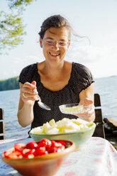 Portrait of mature woman with lake Runn in background - FOLF09195