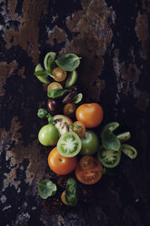 Tomatoes with basil on wooden table - FOLF09420