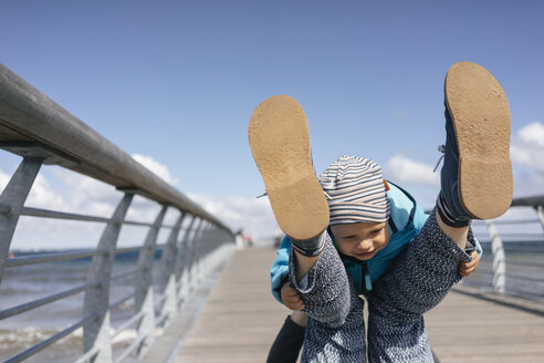 Mother and son playing on jetty - KNSF03696