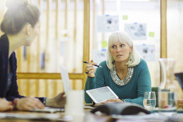 Businesswomen discussing in board room at office - CAVF34814