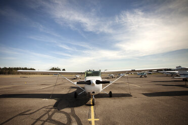 Airplanes at airport against sky - CAVF34953