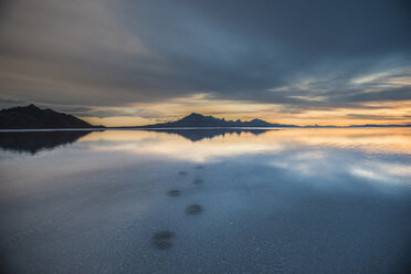 Footprints at Bonneville Salt Flats against stormy clouds - CAVF34986