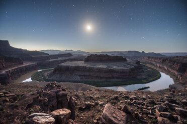 Majestic view of Dead Horse Point State Park against star field during dusk - CAVF35010