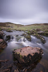 River flowing through rocks against sky - CAVF35038