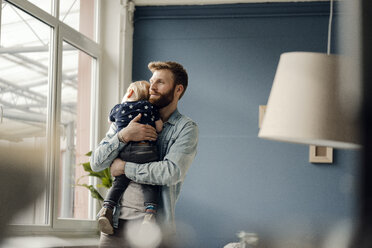 Father spending time with his son at home - KNSF03715