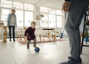 Happy family playing with their son at home - KNSF03755