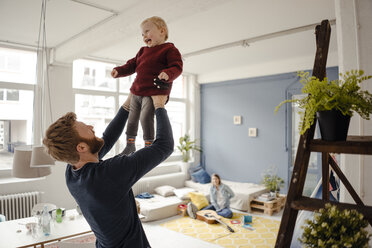 Father and baby son having fun together at home - KNSF03778