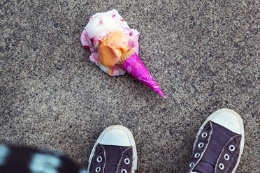 High angle view of ice cream fallen on footpath - CAVF35227