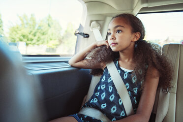 Thoughtful girl looking away while traveling in car - CAVF35241