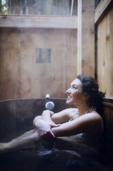 Young smiling woman at sauna - CAVF35337