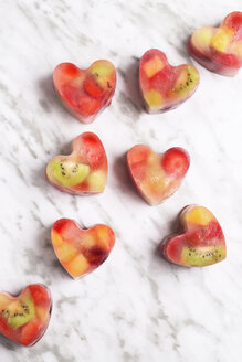 Homemade heart-shaped ice cubes on marble - RTBF01152