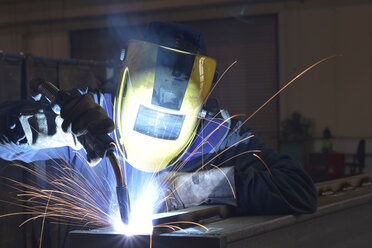 Welder at work in factory - LYF00803