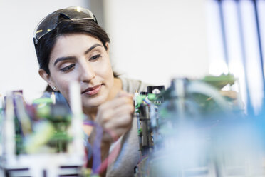 Woman working on motherboard - ZEF15281