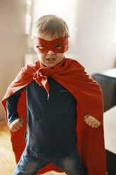 Portrait of little boy dressed up as a superhero at home - ZEDF01311