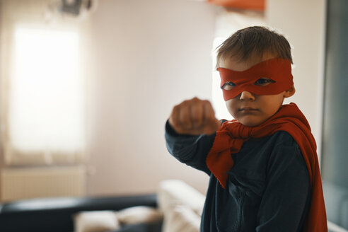 Portrait of little boy dressed up as a superhero at home - ZEDF01317