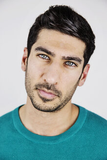 Portrait of young man with blue eyes and stubble - JATF01038