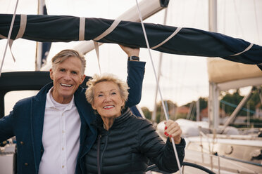 Portrait of smiling senior couple standing in yacht - MASF01437