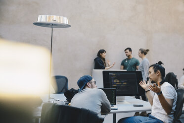 Computer programmers discussing plan in creative office - MASF01851