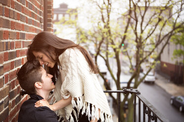 Happy lesbian couple in balcony - CAVF35517