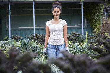 Portrait of gardener standing amidst plants - MASF02136