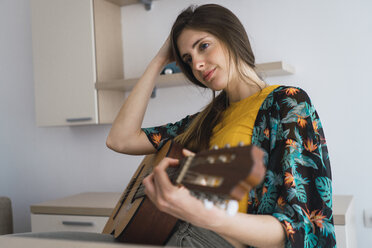 Young woman at home with guitar - KKAF00927