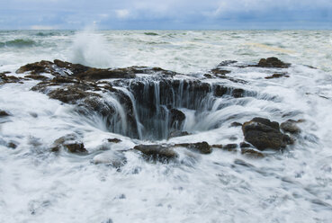 View of sea waves splashing on rock formations - CAVF35549