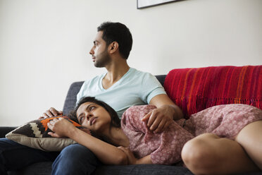 Couple relaxing on sofa at home - CAVF35954