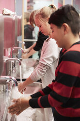 Junior high students washing hands in school - MASF02341