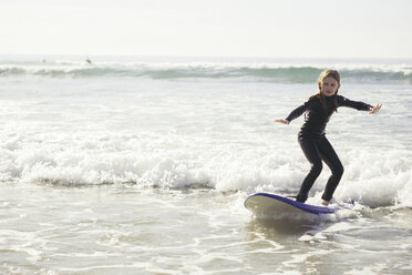 Full length of girl surfing in sea - MASF02503