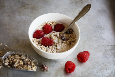 Bowl of homemade granola with raspberries - EVGF03350