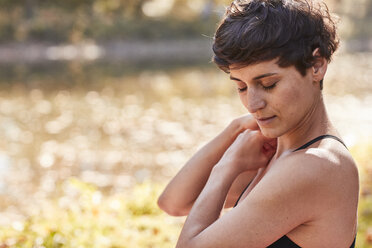 Mid adult woman practicing yoga, meditation - SHOF00012