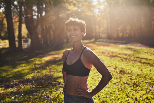 Mid adult woman at forest glade during training - SHOF00031