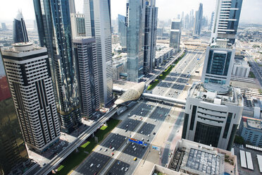Aerial view of city street amidst buildings - CAVF37471