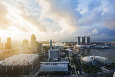 High angle view of modern buildings and river against sky during sunset - CAVF37487