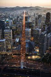 Aerial view of illuminated cityscape at dusk - CAVF37522