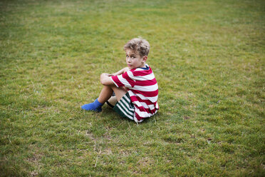 Portrait of boy sitting on grass - CAVF37865