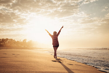 Young woman looking at sunset - CAVF37933