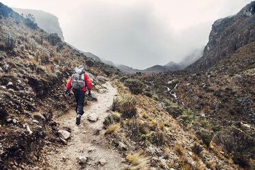 Hiker walking along mountain trail - CAVF37942