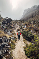 Hiker walking along mountain trail - CAVF37943