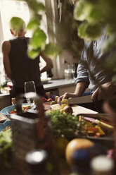 Friends preparing food in kitchen - MASF03660