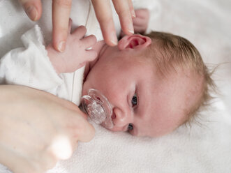 Newborn girl dressing, hands of mother - LAF01999