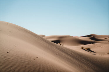 Idyllic view of sand dunes against clear sky - CAVF38282