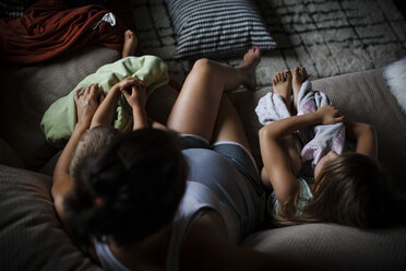 High angle view of mother with children on sofa - CAVF38339