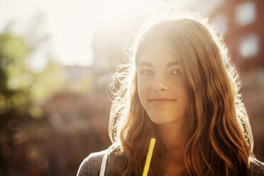 Portrait of smiling teenage girl outdoors - MASF04076