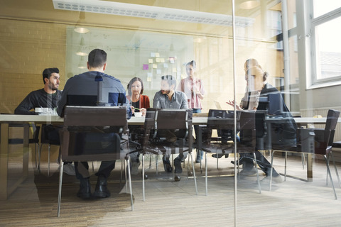 Multi-ethnic business people having discussion in conference room stock photo